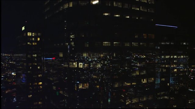 Flying past Los Angeles skyscrapers at night. Shot in 2010.
