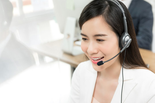Asian woman telemarketing call center staff