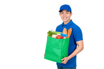 Asian delivery man carrying groceries in green reusable bag