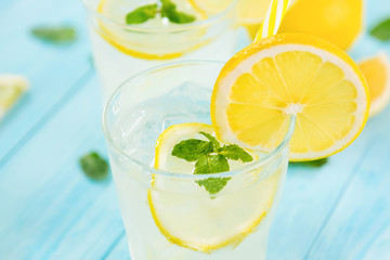 Refreshing drinks for summer, cold  lemonade juice with sliced fresh lemons
