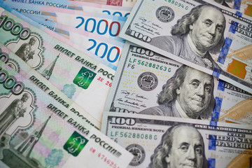 Fototapeta na wymiar New banknote hundred dollars and russian rubles.