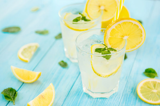 Refreshing drinks for summer, cold  lemonade juice with sliced fresh lemons