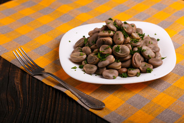 boiled broad beans on a rustic background