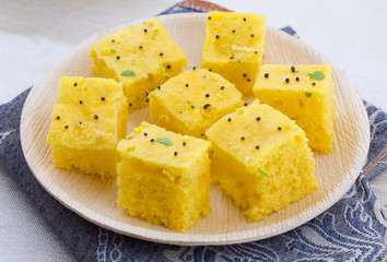 Indian Traditional Street Food Khaman Dhokla Served With Chutney & Chilli