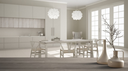 Wooden table top or shelf with minimalistic modern vases over blurred classic white kitchen with dining table, white interior design