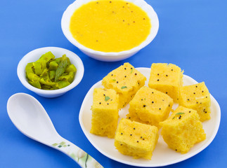 Indian Traditional Street Food Khaman Dhokla Served With Chutney & Chilli