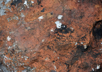 Stains and cracks on stone surface , Black and gray stripes on brown colored  ,Abstract background and texture for add text or graphic design 
