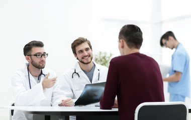 Fototapeta premium doctors discuss with the patient the x-ray