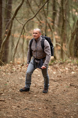 Hiker with backpack on a trail