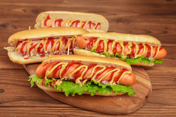 Hot dogs on wooden background