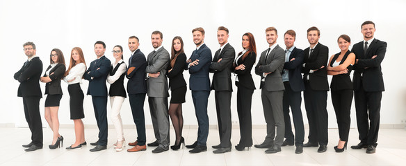 large business team standing arms crossed in front