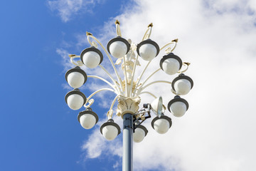 Fototapeta na wymiar modern street light with multiple bulbs against blue sky