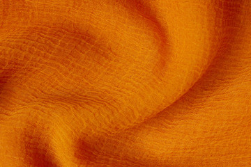 Orange textured fabric background