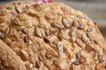 closeup oat large biscuits with sesame, flax and sunflower seeds. Macro