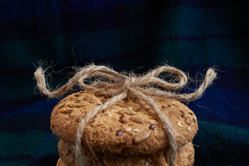 homemade oat cookies with sunflower seeds on dark blue background
