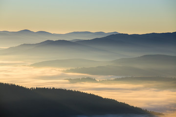 Sunrise against the background of the Carpathian mountains in the summer. Ukraine
