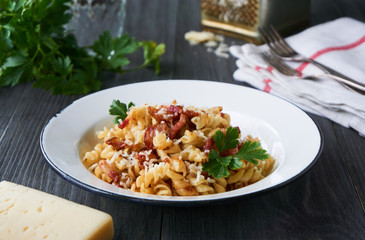 Pasta with bacon and cheese in a bowl     