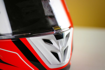 The visor on the helmet is closed on the lock. Moto helmet design. Close up