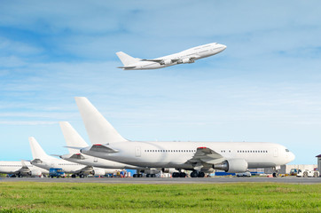 Passenger aircraft row, airplane parked on service before departure at the airport, other plane...