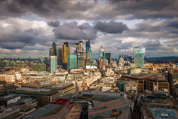 London, England - Panoramic skyline view of Bank and Canary Wharf, central London's leading financial districts with famous skyscrapers at golden hour sunset. Beautiful sky and clouds