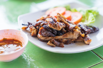 Grilled pork on white dish background.