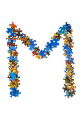 Letter M made of puzzle pieces