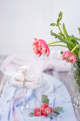 marshmallows in a glass stand and red marmalade