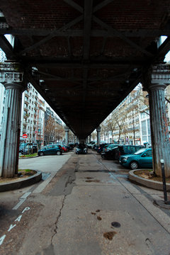 Cars parked under bridge