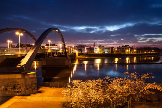 Fototapeta Border on bridge between Germany and Poland, view from Frankfurt Oder to Slubice city on evening