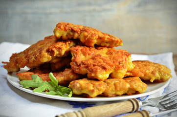 Chicken cutlets on white plate
