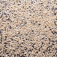 Oat flakes close up, background or texture, square. healthy diet food