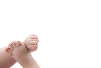 baby feet on white blanket. copy space. selective focus - obrazy, fototapety, plakaty