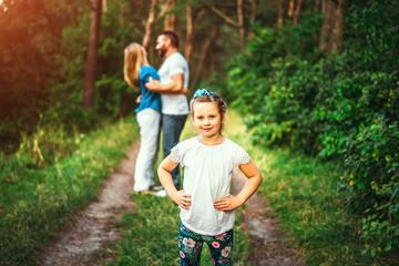 Fototapeta premium Happy pretty family have fun outdoor