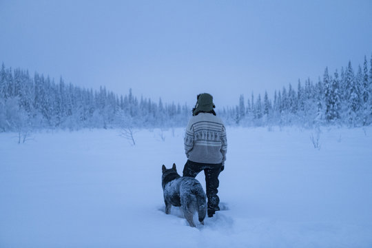 Woman with dog at winter