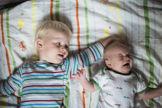 Kids in cot