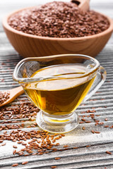 flaxseed and oil on a rustic background