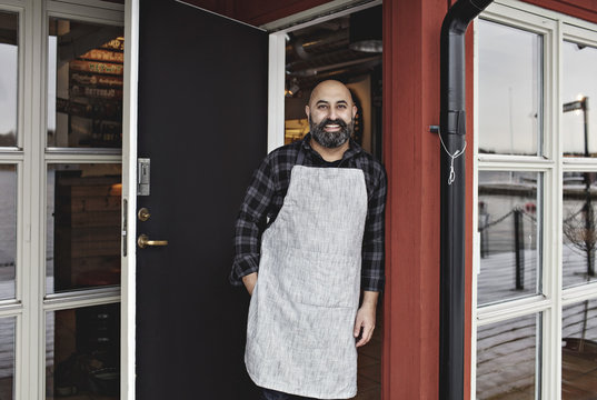 Portrait of bartender outside bar