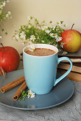 Blue Cup of Coffee milk hot drink cinnamon sticks Books Red Apples Camomile Flower Buquet