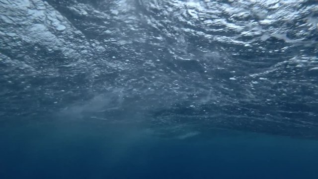 Strong tropical downpour in ocean, underwater view 
