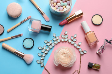 Flat lay composition with decorative cosmetics on color background