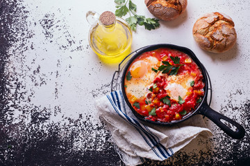 Fried eggs and tomatoes on white background