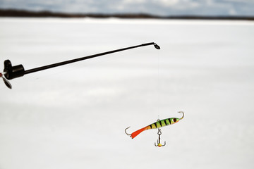 Fishing rod for winter fishing with a balancer