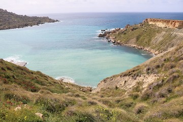 Fototapeta na wymiar Summer in Gnejna Bay at the Mediterranean Sea in Malta