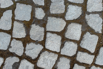 Background of stone-paved uneven track