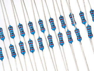 Close up group of blue color electronic resistors on a white background