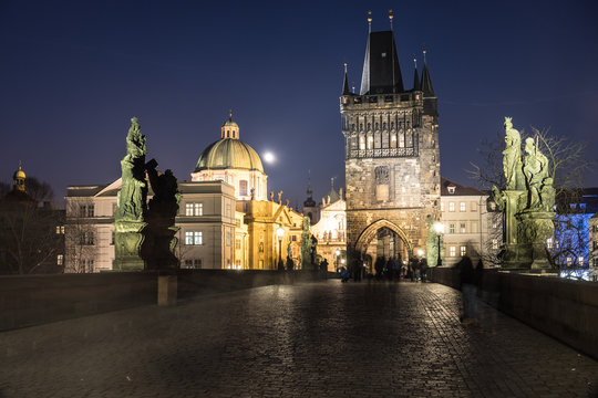 Night view of the the Old Town Bridge Tower on the Charles bridge at night in Prague, Czech Republic