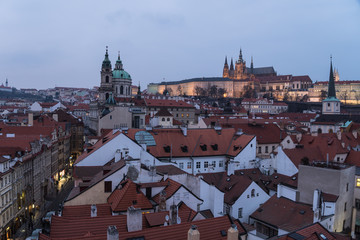 Fototapeta premium The castle and the Saint Vitus cathedral overlooking Prague old town cityscape in Prague at twilight in Czech Republic capital city.