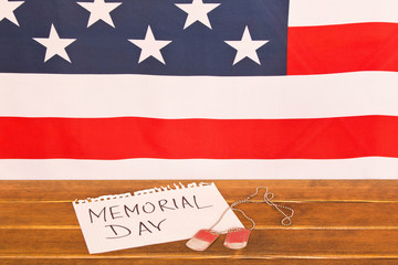 American flag and army tokens on memorial day . On wooden background