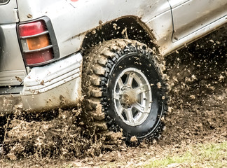 Car wheel in the dirt and water © kvdkz