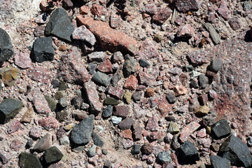 Made from pebble gravel stones different shape as floor texture background. Small rocks background texture, abstract stone texture pebbles.